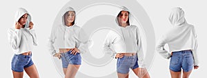 Mockup of a white crop top on a young girl in blue shorts, an empty hoodie for design presentation, front view, side view, back