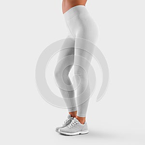 Mockup of white leggings on a slender girl, in the studio on an isolated clean background, skinny women`s pants for presentation