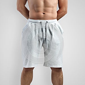 Mockup of white men`s shorts on an isolated background, front view