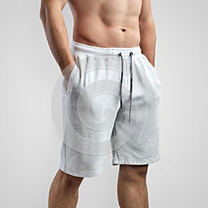 Mockup of white men`s shorts on an isolated background, side view