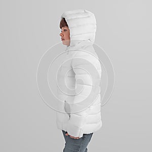 Mockup of a winter warm jacket on a girl in a hood, side view