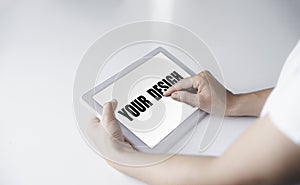 Mockup of a woman using a white tablet On her desk  Copy space 