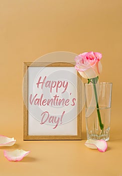 Mockup Wooden frame with text HAPPY VALENTINES DAY on delicate pink roses on beige background. Minimal trendy