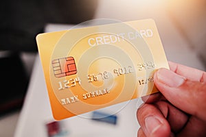 Mockup of yellow credit card in hand