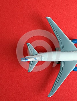 Model aircraft on red