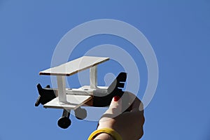 Model airplane on blue sky