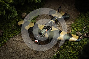 Model of airplane IL-2 with soldiers in diorama photo