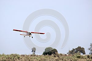 A model airplane stunt plane spinning. Model: tri 60