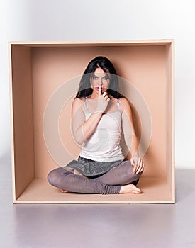 Model asks for silence - trapped in box concept