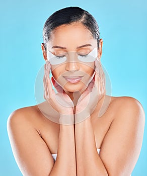 Model, beauty and eye patches with skincare glow from spa treatment and cosmetics. Woman, hand and face of a person