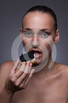 Model biting off a piece of bread