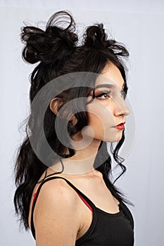 model with black hair with half up down space buns hairstyle style rave event fun fashion beauty