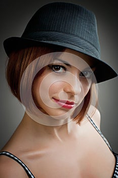 Model in black trilby style hat photo