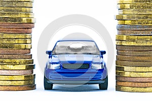 Model of blue car and coins on a white background