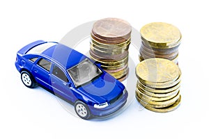 Model of blue car and coins on a white background