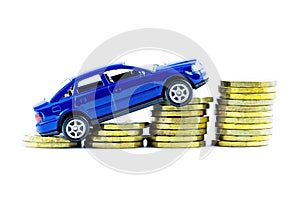 Model of blue car and coins on a white background