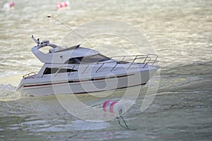 Model boat floats in the pool