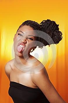 Model with braids and tongue stuck out