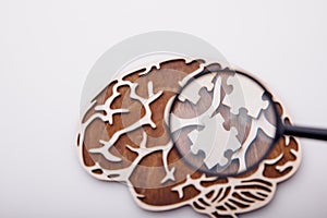 Model of brain with wooden puzzles. Mental Health and problems with memory concept