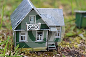 A model of a Russian country house with a barn and a well.