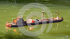 Model of a cargo ship in the pond