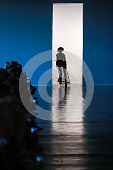 Silhouette of model on catwalk. photo