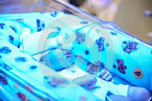 Child in crib of intensive care unit