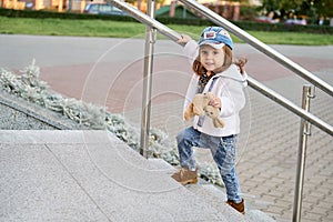 Model child hip-hop.girl child street fashion jeans clothes