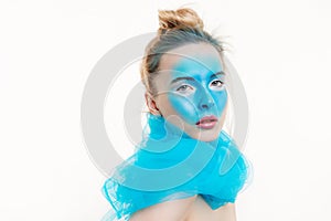 Model with a creative art make-up on her face