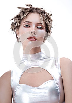 Model with creative futuristic hair style and silver clothes