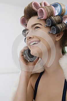 Model In Curlers Talking On Cellphone