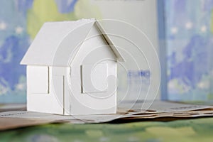 Model of detached house and European Union money