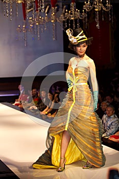 A model displays a creation by Carven Ong