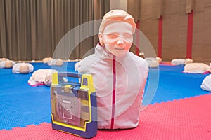 model dummy with AED or Automated External Defibrillator for CPR training medical in class