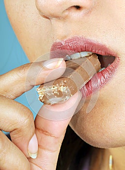 Model eating chocolate