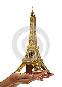 Model Eiffel Tower in the women's hand.