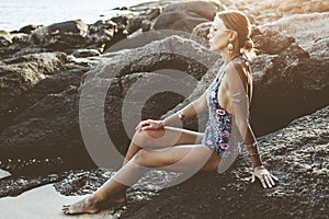 Model in ethnic monokini and wearing boho jewellery