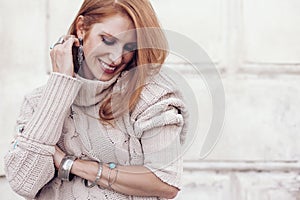 Model in fall cozy sweater and boho jewellery