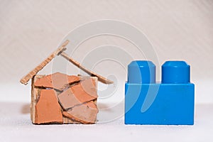Model of a family house with a children`s play brick