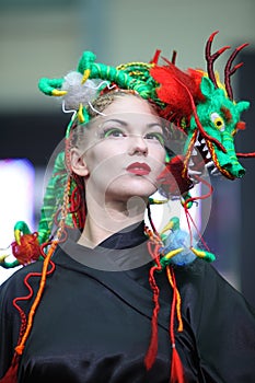 Model with fanciful braiding hairdo