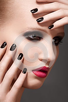 Model with fashion lips make-up and nails manicure