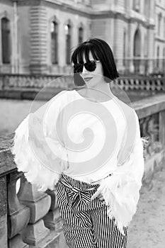 Model in fashionable clothes on street of paris, france