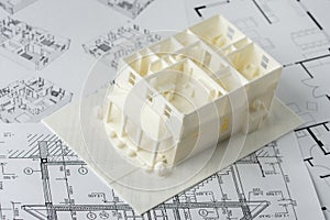 Model of the first and second floor of a family house printed on a 3D printer with white filament by FDM technology for