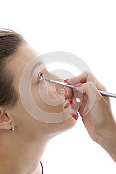 Model getting eye makeup