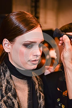 A model getting ready backstage at the Nicole Miller fashion show during MBFW Fall 2015