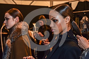 A model getting ready backstage at the Nicole Miller fashion show during MBFW Fall 2015