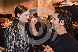 A model getting ready backstage at the Nicole Miller fashion show during MBFW Fall 2015