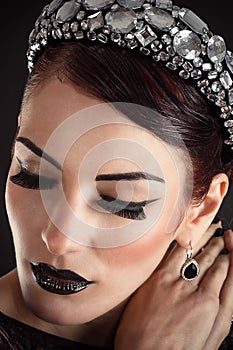 Model girl with black makeup and long eyelashes