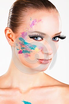 Model girl with fake long eyelashes blue eyes smokey eye shadow abstract makeup
