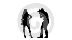 Model girl posing for a photographer. Silhouette. White background. Slow motion